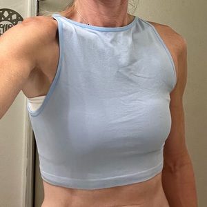 Small, stretchy crop top. Unknown brand but super cute with jeans!